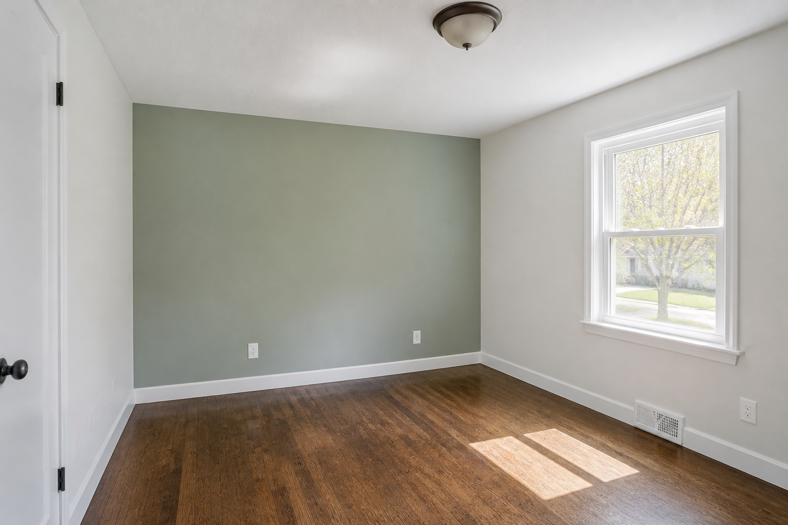 Residential bedroom interior painting with an accent wall in Grand Island, NE